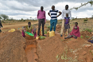 UCCA team with a local woman in Moroto